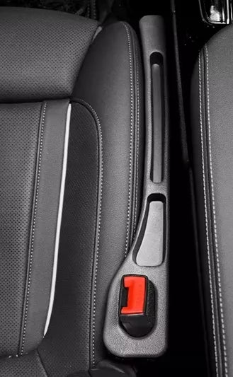 2 vnt. Organizatorius tarpų užpildas automobilio sėdynės šonui su diržo tuneliu