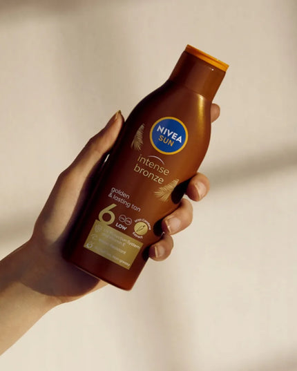 NIVEA SUN rinkinys: karoteninis losjonas SPF6 + įdegį pratęsiantis losjonas + DOVANA